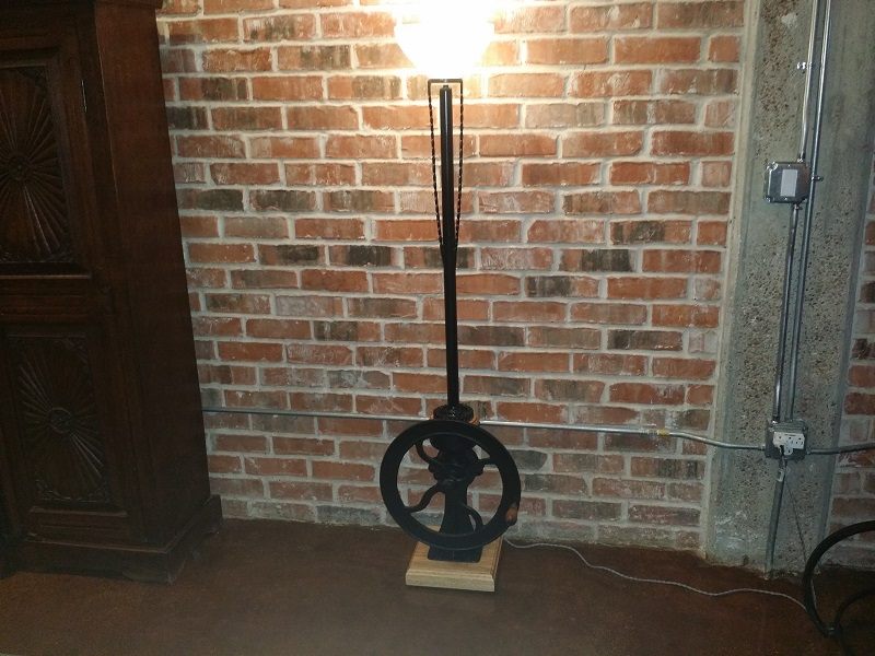 Antique grain mill floor lamp