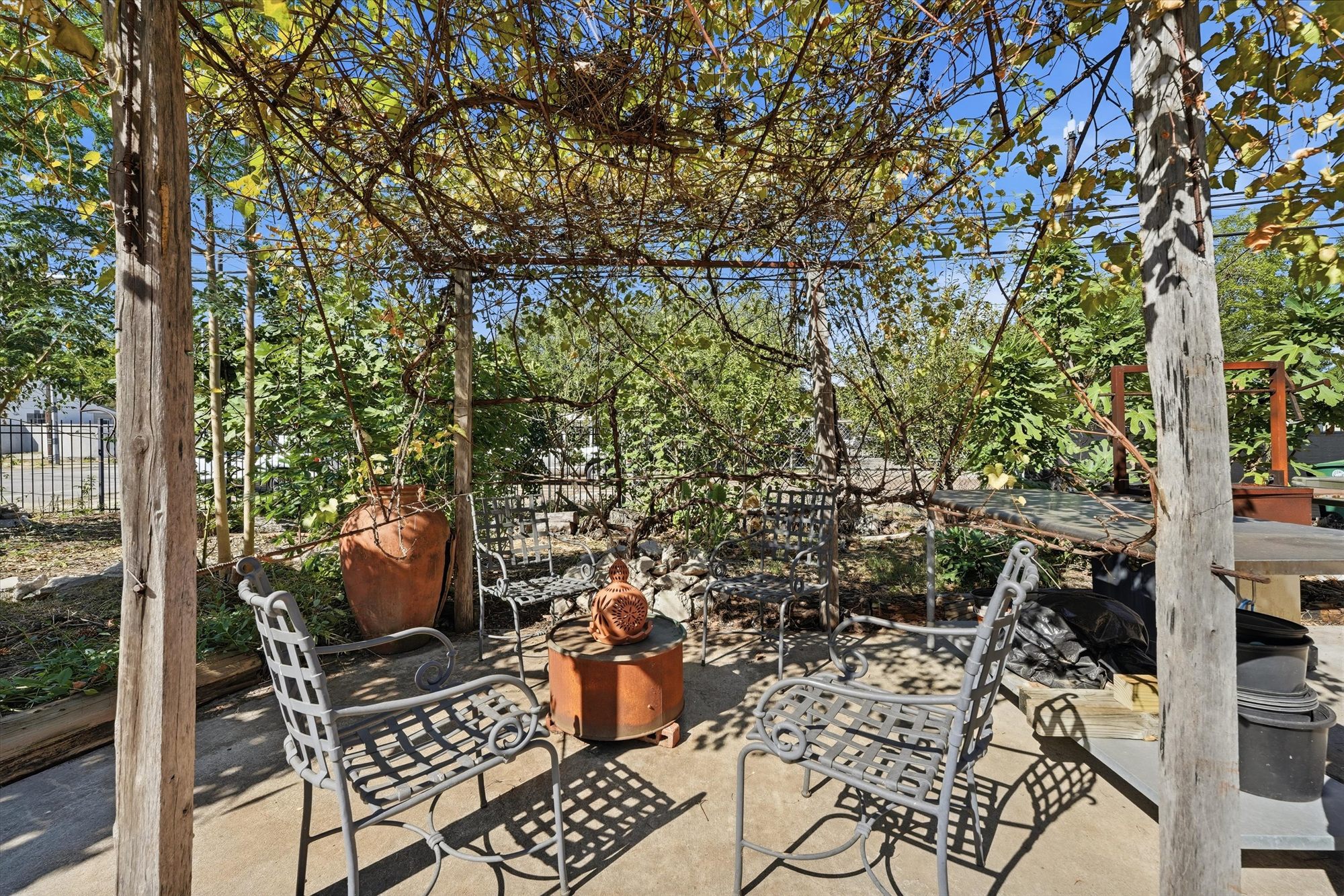 Seating under the vine-covered pergola